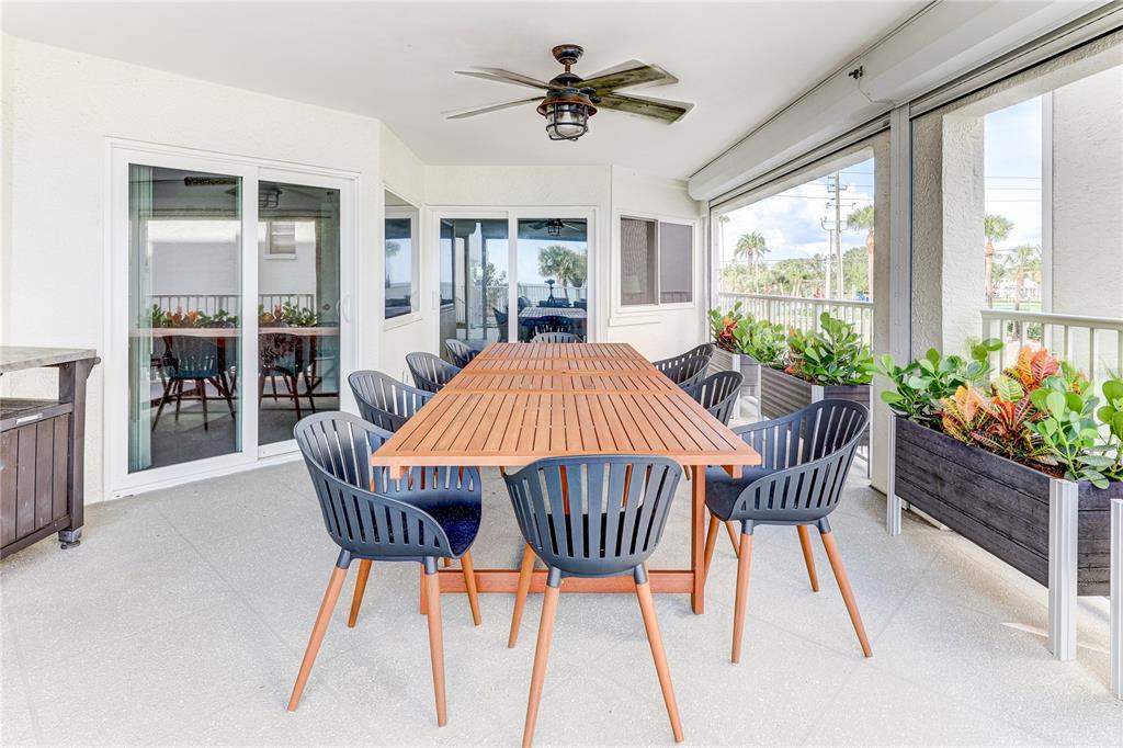 16332 Gulf Boulevard, Unit 1C Redington Beach, FL 33708 - Photo 69 of 90 a dining room with furniture window and wooden floor