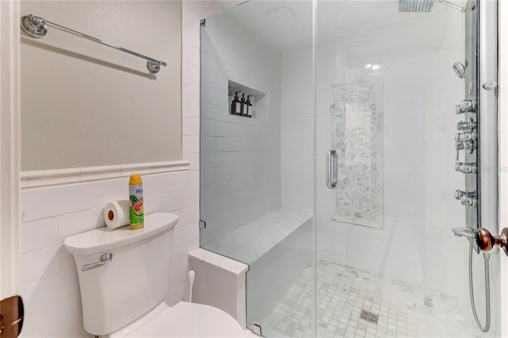 16332 Gulf Boulevard, Unit 1C Redington Beach, FL 33708 - Photo 75 of 90 a white toilet sitting next to a bath tub