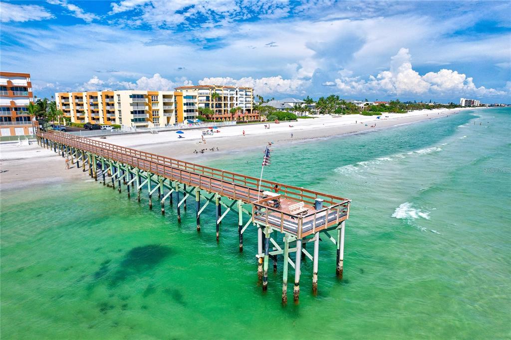 16332 Gulf Boulevard, Unit 1C Redington Beach, FL 33708 - Photo 86 of 90 a view of a terrace with lawn chairs and iron fence
