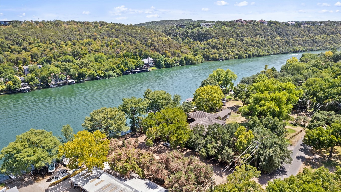 2805 Pearce Road Austin, TX 78730 - Photo 17 of 24 a view of a lake with a mountain in the background