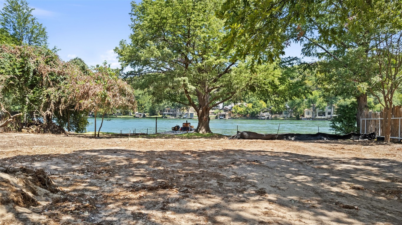 2805 Pearce Road Austin, TX 78730 - Photo 6 of 24 a backyard of a house with trees