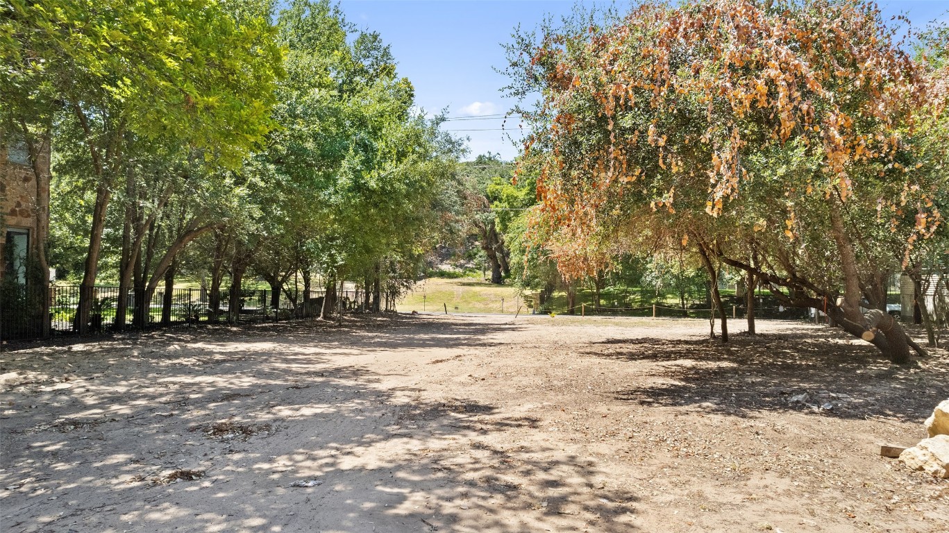 2805 Pearce Road Austin, TX 78730 - Photo 7 of 24 a house with trees in front of it