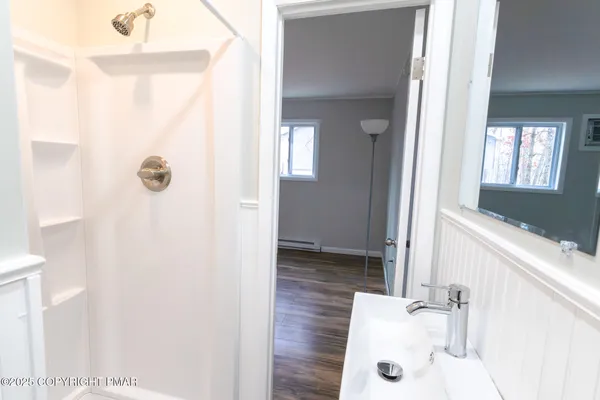 a bathroom with a tub and a sink