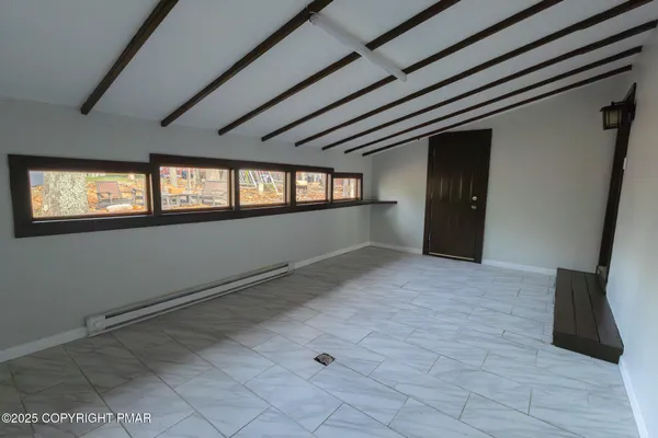 a view of an empty room with a window