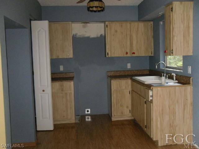 18812 Matanzas Road Fort Myers, FL 33967 - Photo 6 of 8 a room with a sink and cabinets