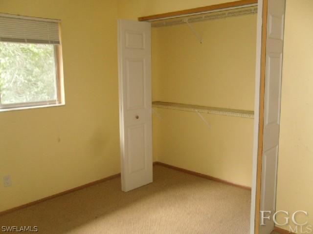 18812 Matanzas Road Fort Myers, FL 33967 - Photo 7 of 8 a view of a small space with wooden floor and a window