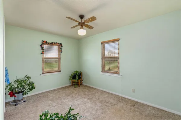 a view of livingroom with window and ceiling fan