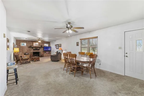 a view of a livingroom with furniture and a chandelier