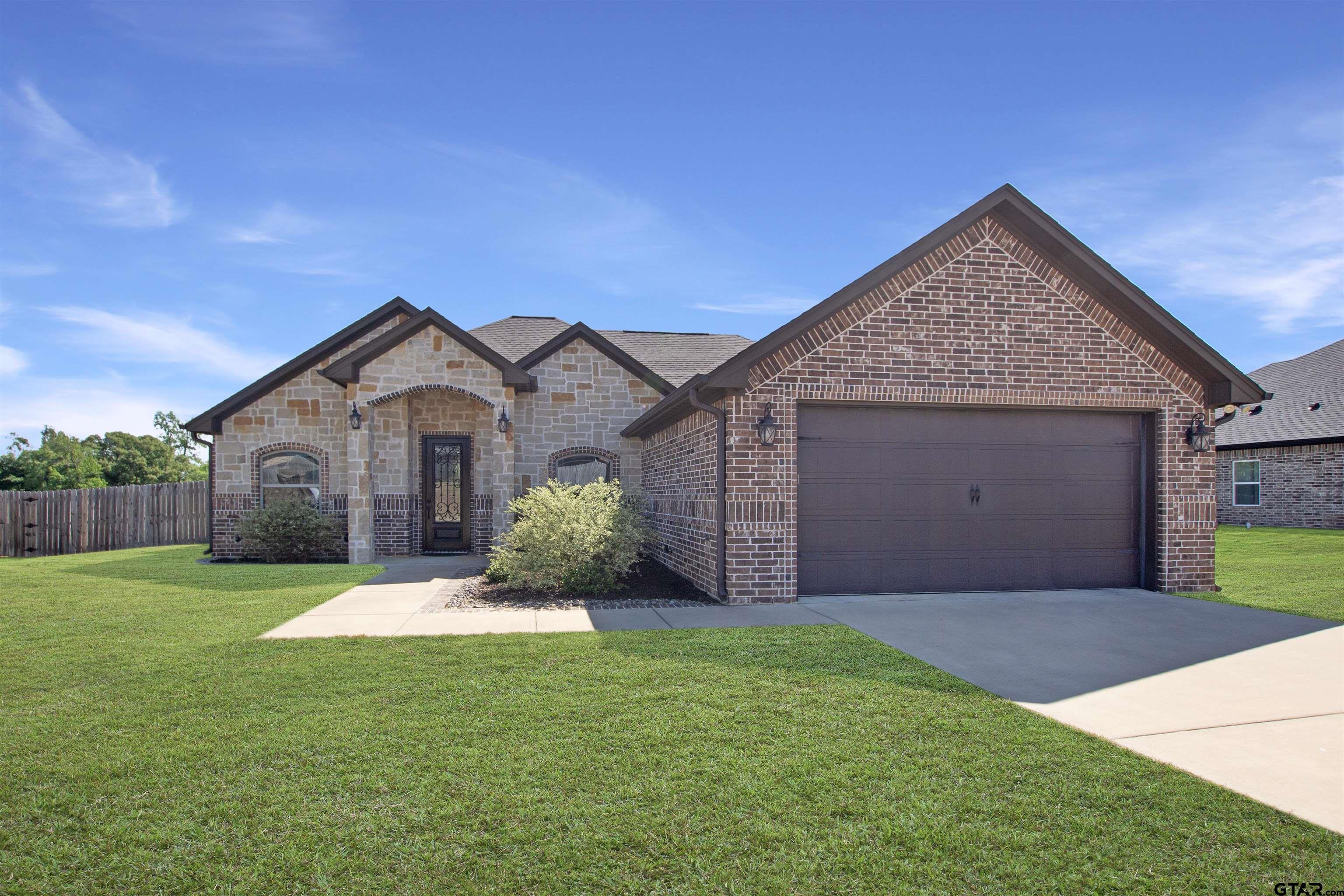344 Duke Place Tyler, TX 75704 - Photo 1 of 36 a front view of house with yard and garage