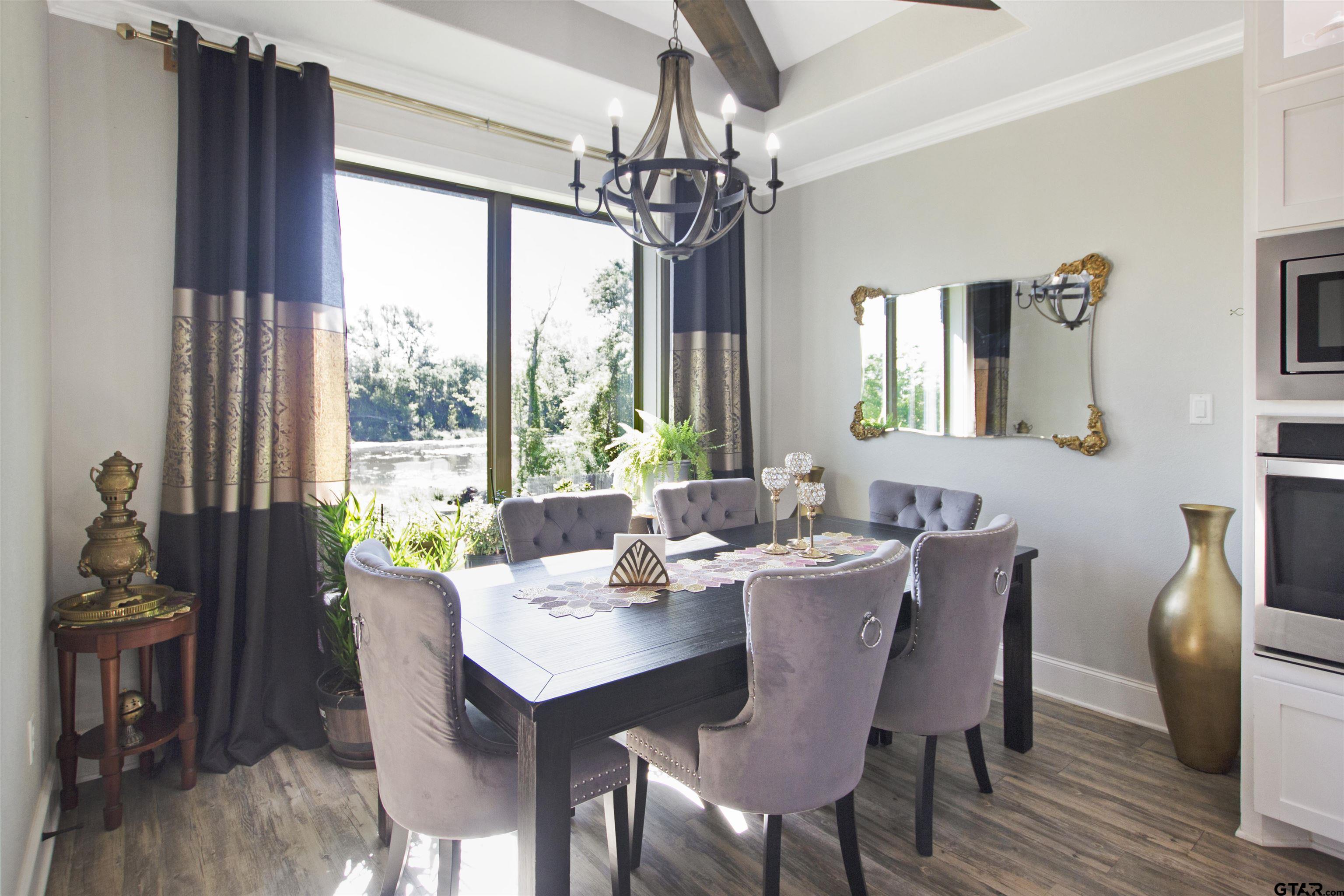 344 Duke Place Tyler, TX 75704 - Photo 12 of 36 a view of a dining room with furniture window and wooden floor