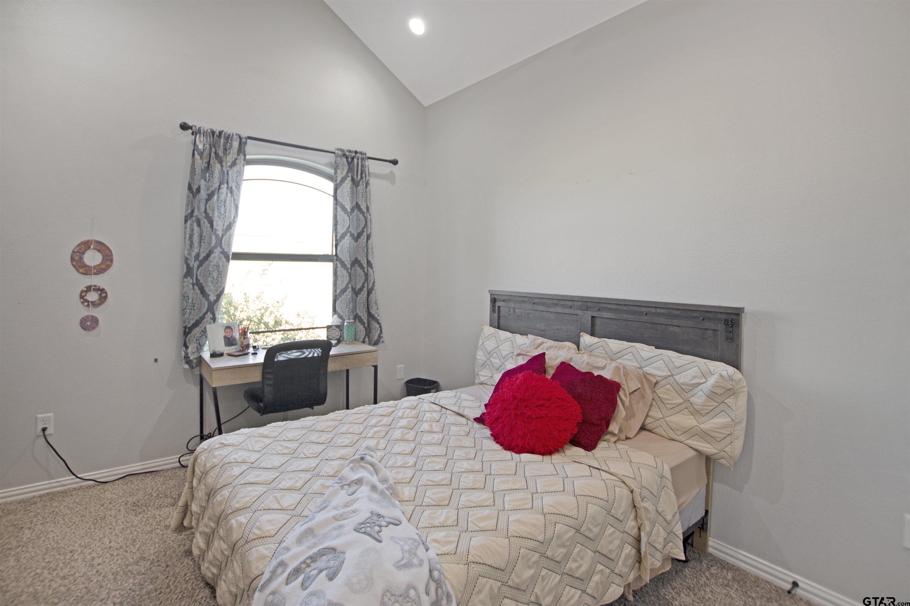 344 Duke Place Tyler, TX 75704 - Photo 15 of 36 a bedroom with a bed and a window
