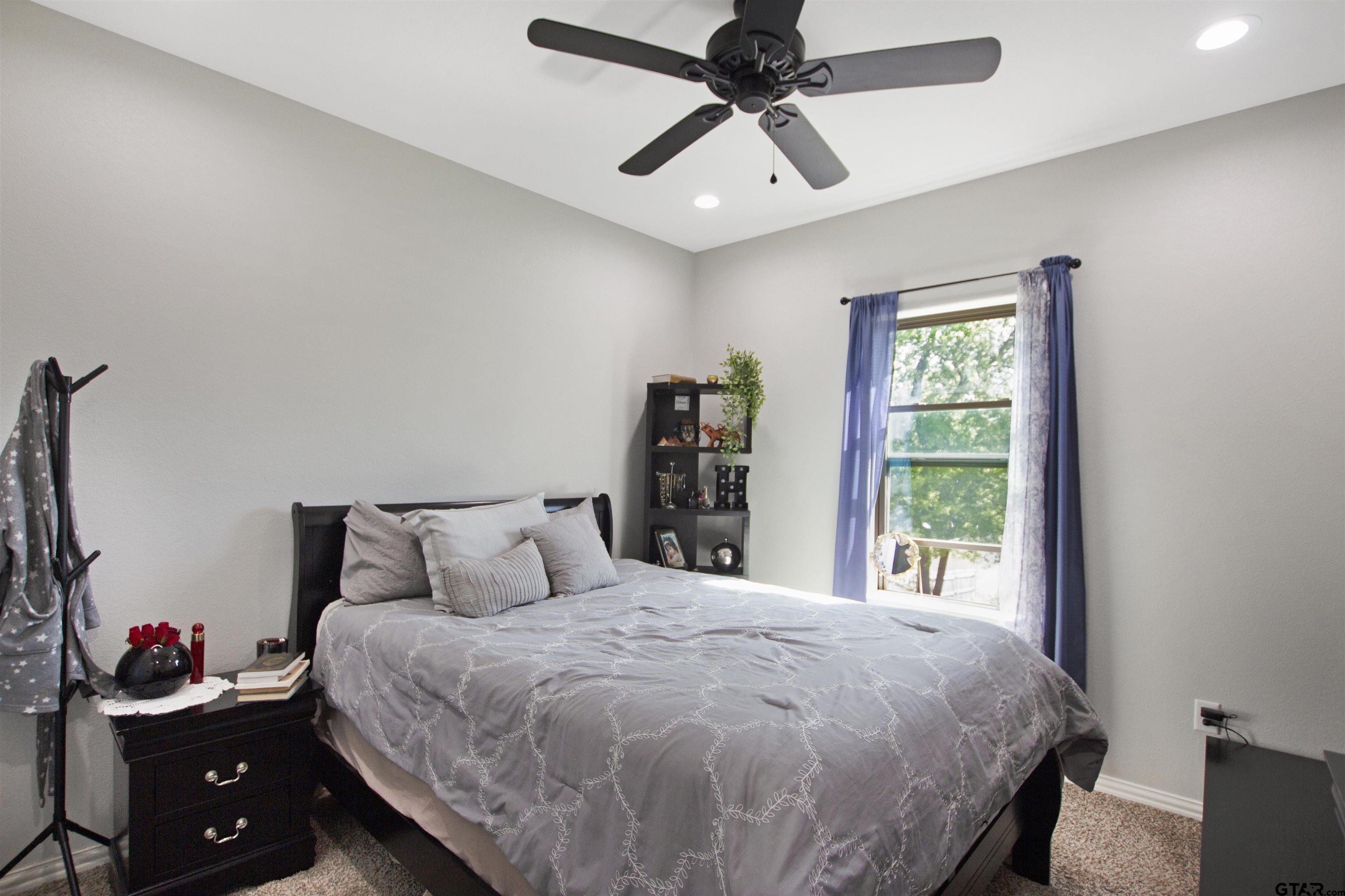 344 Duke Place Tyler, TX 75704 - Photo 20 of 36 a bedroom with a bed and a window