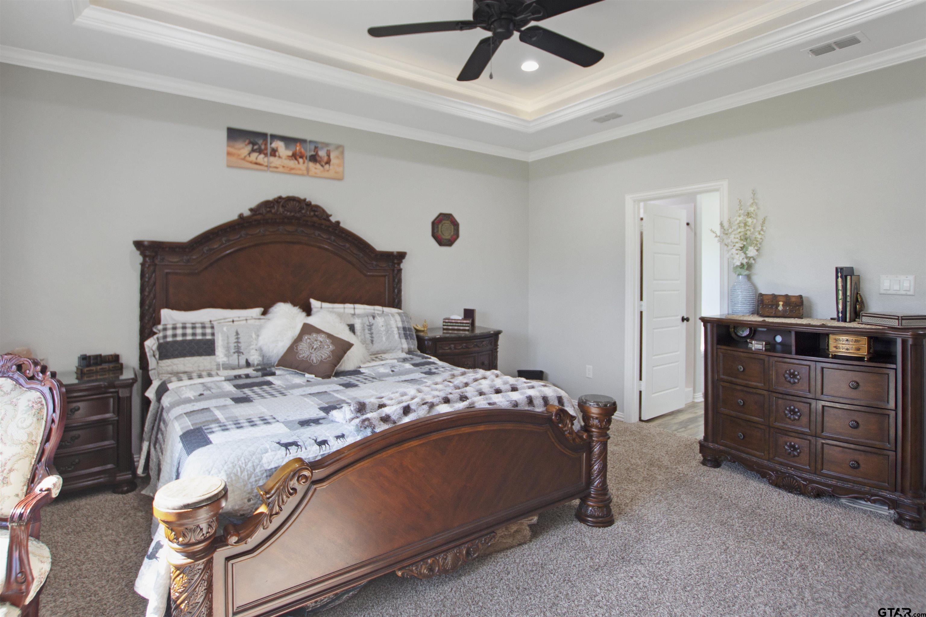 344 Duke Place Tyler, TX 75704 - Photo 24 of 36 a bedroom with a bed and a dresser