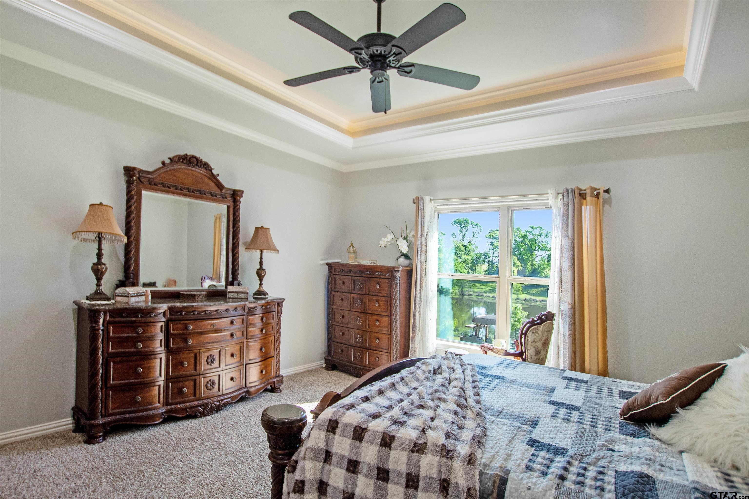 344 Duke Place Tyler, TX 75704 - Photo 25 of 36 a bedroom with a bed dresser and a window