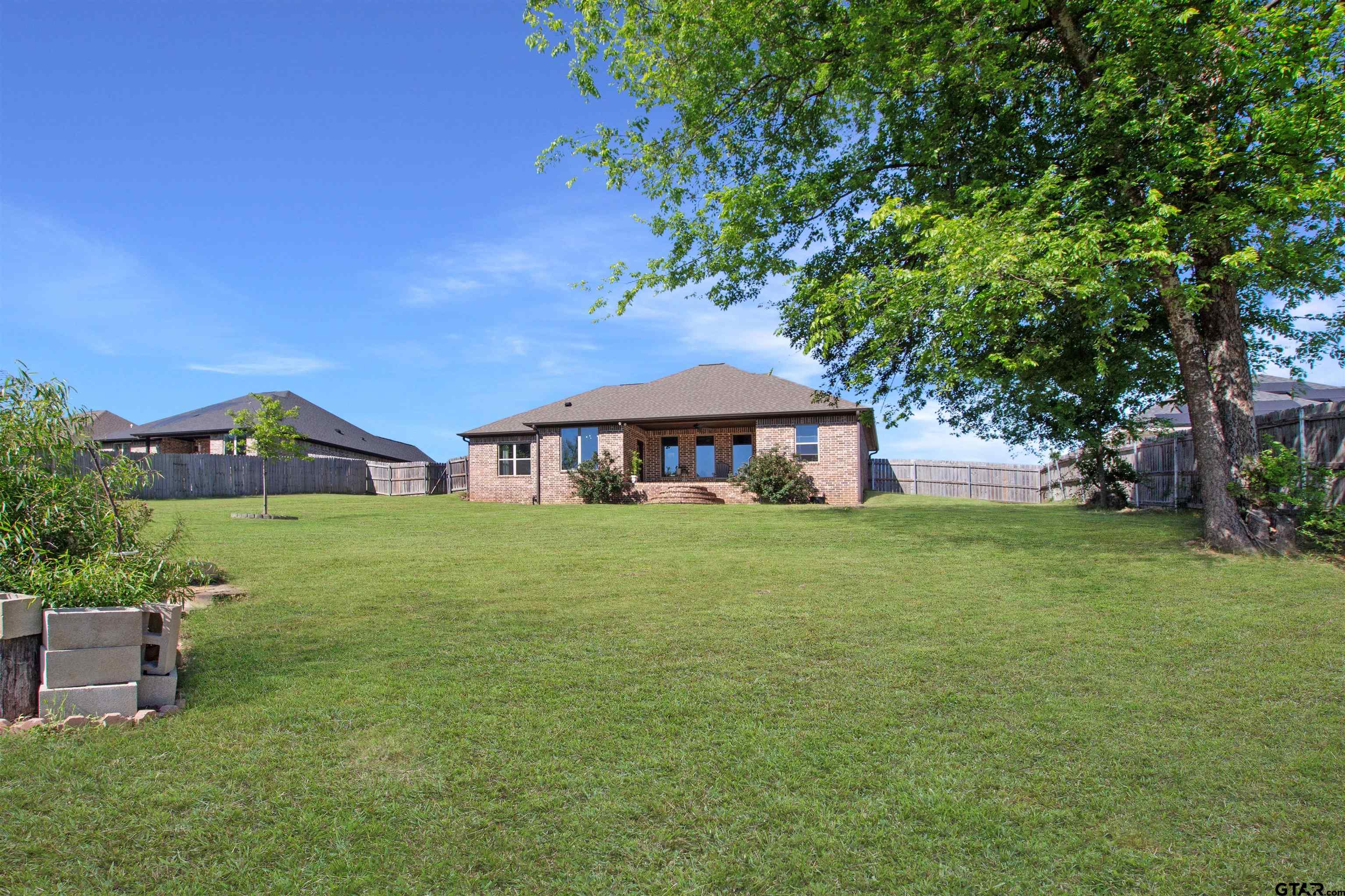 344 Duke Place Tyler, TX 75704 - Photo 36 of 36 a front view of a house with a garden