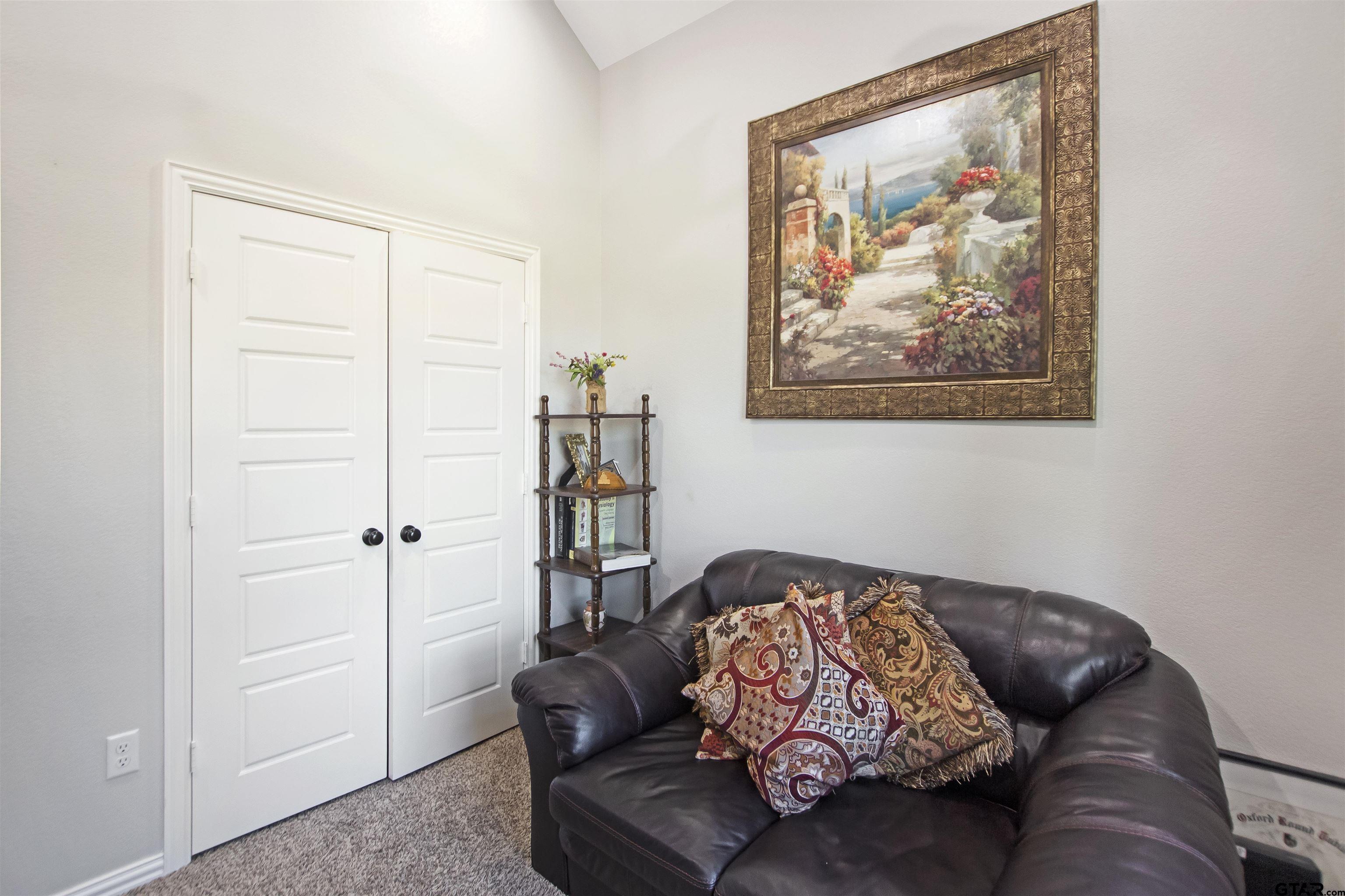 344 Duke Place Tyler, TX 75704 - Photo 5 of 36 a living room with furniture and a painting on the wall