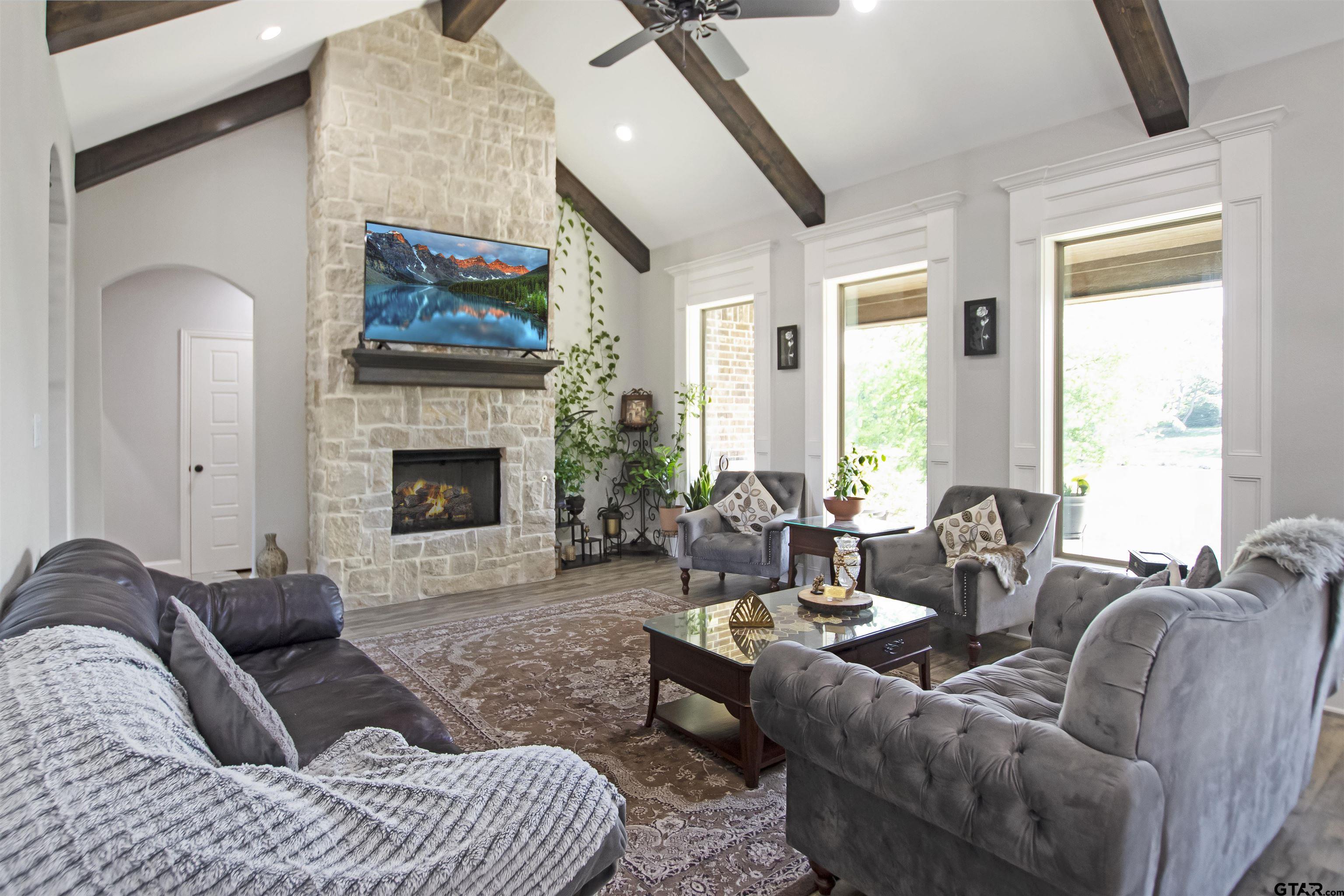 344 Duke Place Tyler, TX 75704 - Photo 7 of 36 a living room with furniture windows and a fireplace