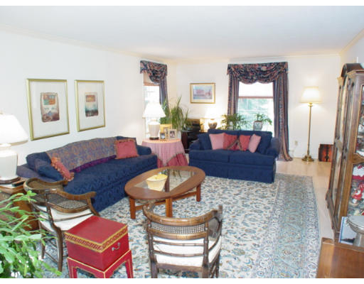 8 Regis Road Andover, MA 01810 - Photo 11 of 16 a living room with furniture and a large window
