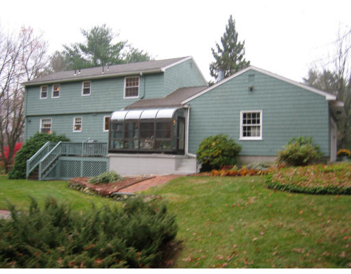 8 Regis Road Andover, MA 01810 - Photo 2 of 16 a house view with a garden space