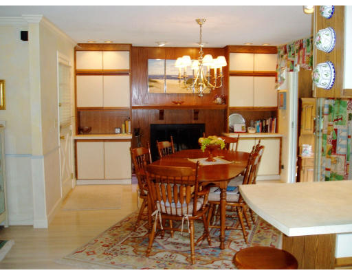 8 Regis Road Andover, MA 01810 - Photo 3 of 16 a dining room with furniture a floor to ceiling window and wooden floor