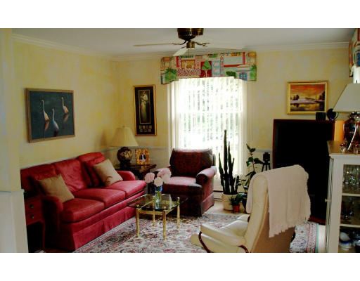 8 Regis Road Andover, MA 01810 - Photo 5 of 16 a living room with furniture a window and a flat screen tv