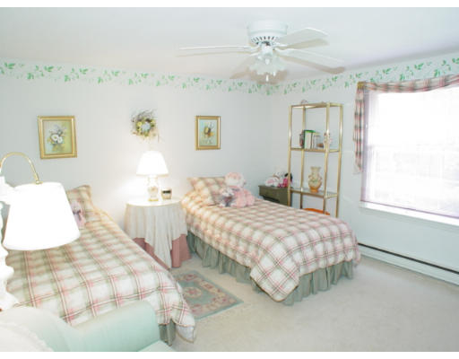 8 Regis Road Andover, MA 01810 - Photo 8 of 16 a bedroom with a bed and window