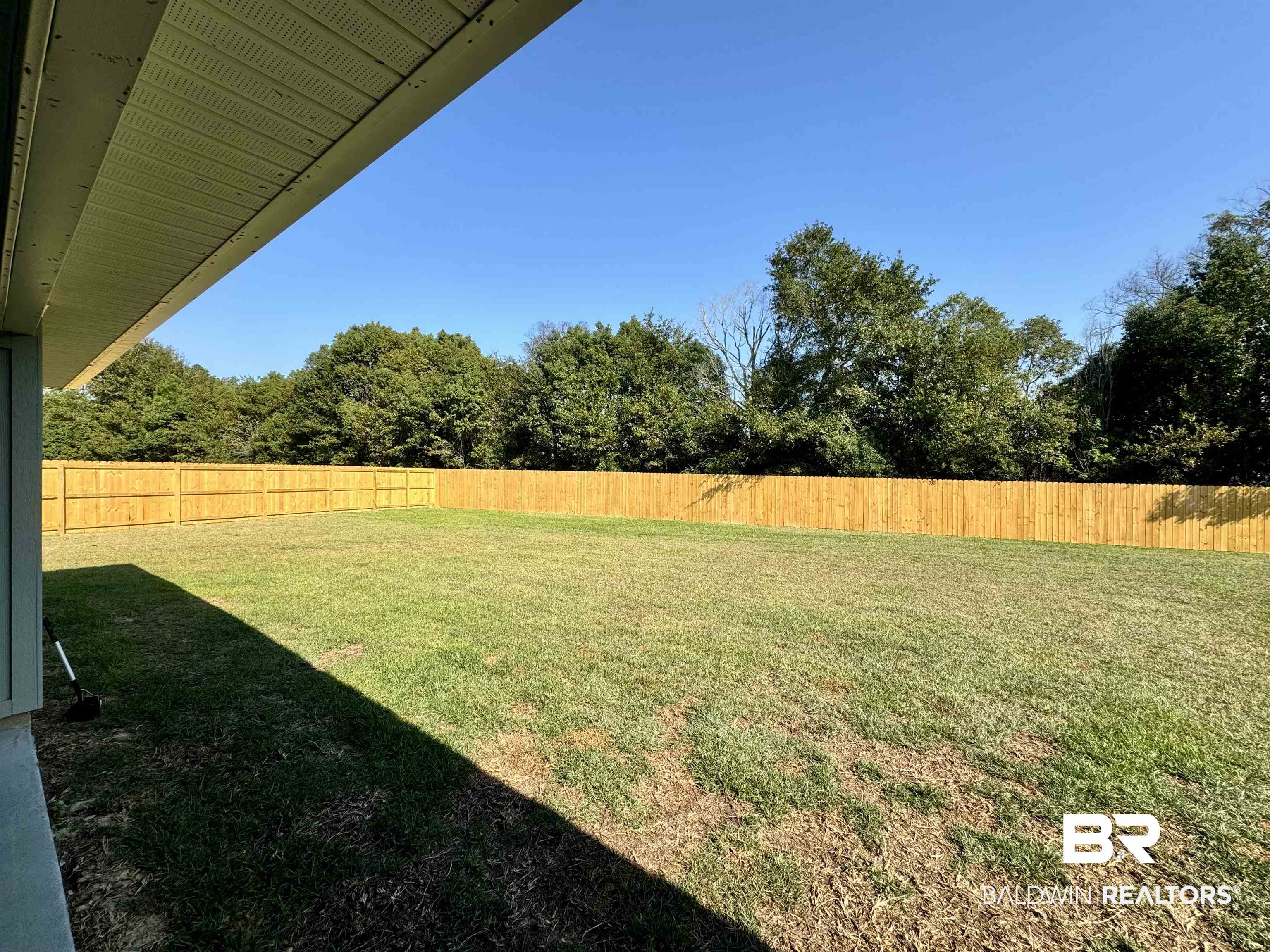 24216 Ringneck Loop Elberta, AL 36530 - Photo 11 of 23 Fenced backyard featuring a patio area