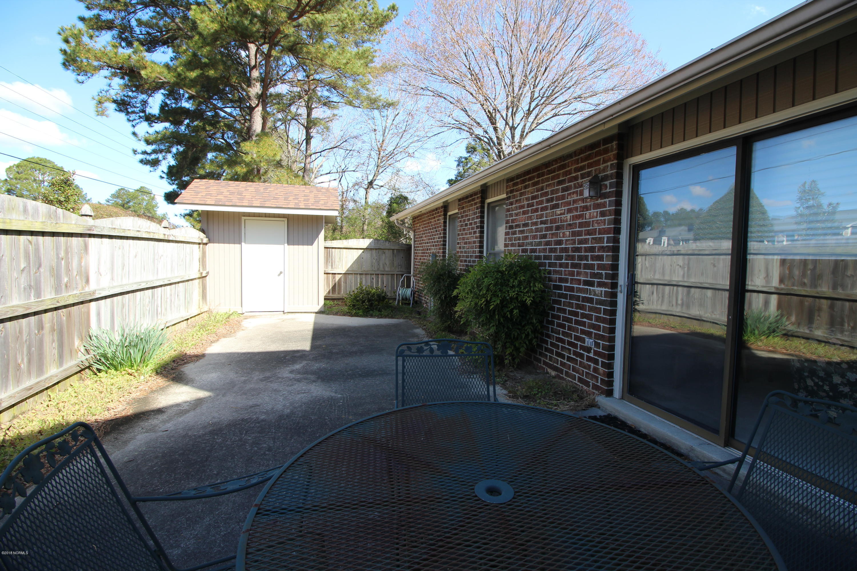 1866 Quail Ridge Road, Unit M Greenville, NC 27858 - Photo 14 of 31 Across Patio toward Storage