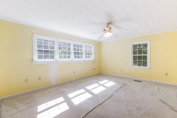 a view of an empty room with a window