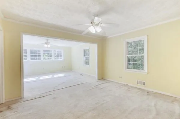 a view of an empty room with a window