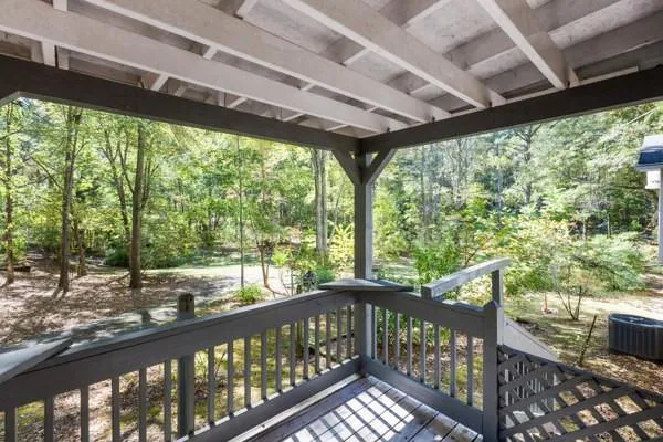 a view of a porch with wooden floor
