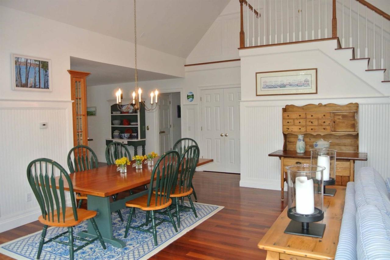 15 Harbor Ridge Road Mashpee, MA 02649 - Photo 12 of 27 a dining room with furniture kitchen view and wooden floor