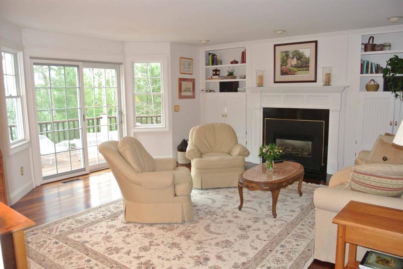 15 Harbor Ridge Road Mashpee, MA 02649 - Photo 14 of 27 a living room with furniture and a fireplace