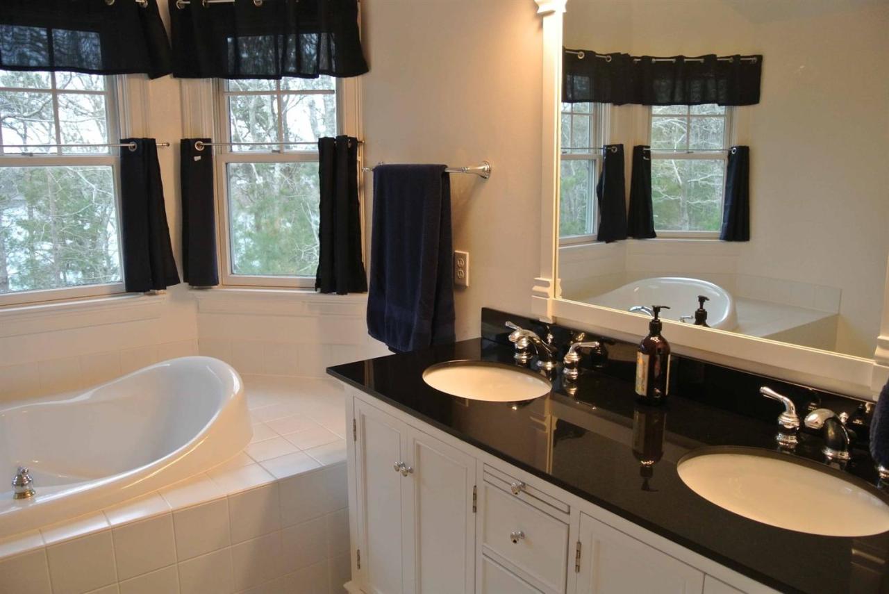 15 Harbor Ridge Road Mashpee, MA 02649 - Photo 17 of 27 a bathroom with a granite countertop sink and a mirror