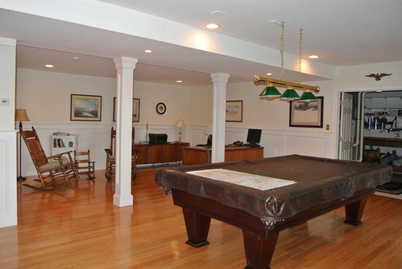 15 Harbor Ridge Road Mashpee, MA 02649 - Photo 20 of 27 a living room with hard wood flooring and a table