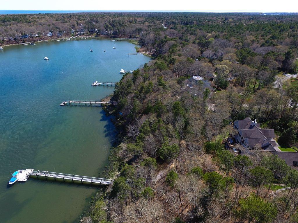 15 Harbor Ridge Road Mashpee, MA 02649 - Photo 27 of 27 an aerial view of green landscape with trees houses and lake view