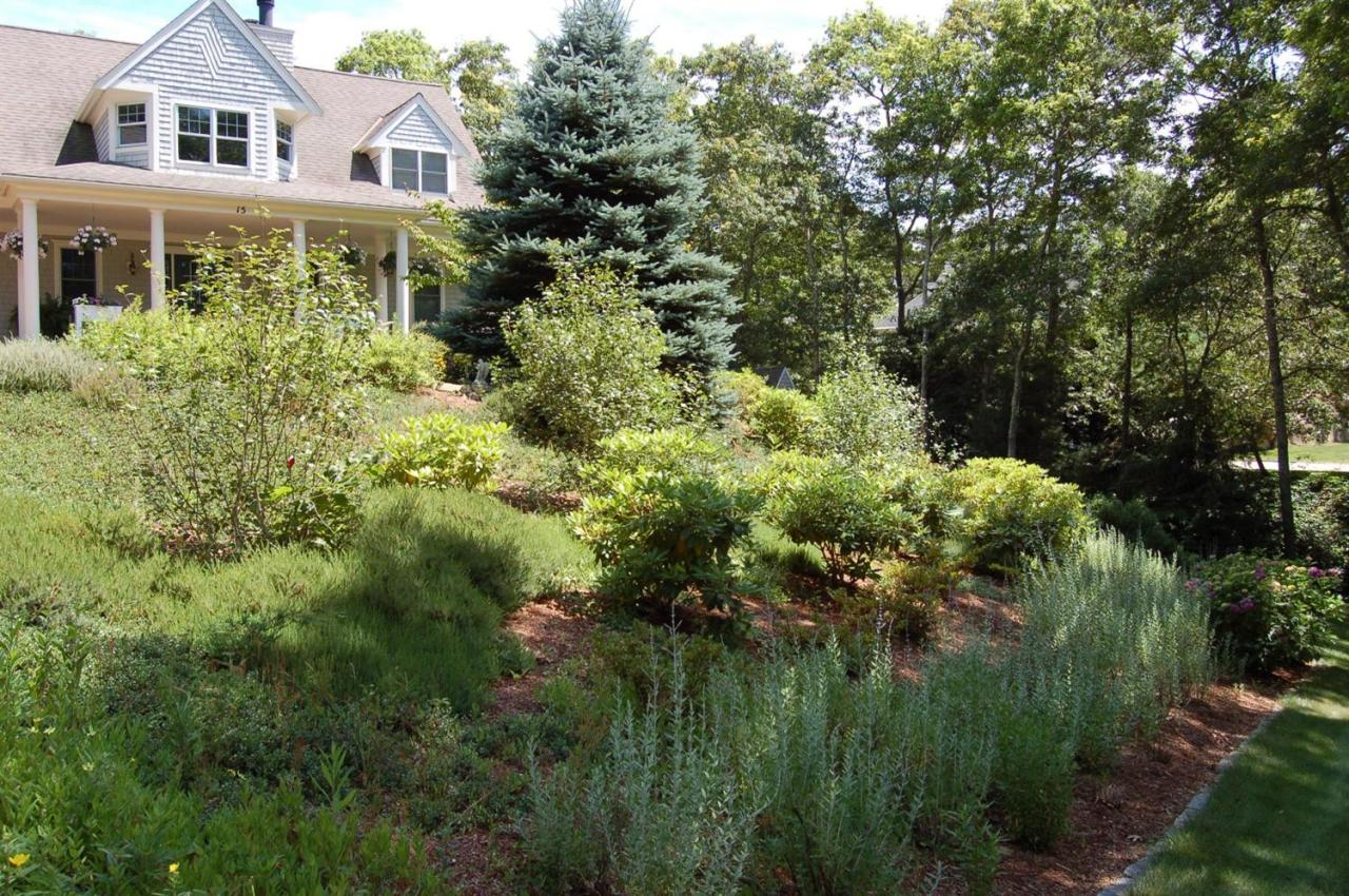 15 Harbor Ridge Road Mashpee, MA 02649 - Photo 6 of 27 a aerial view of a house with a yard and potted plants