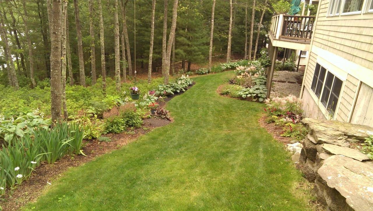 15 Harbor Ridge Road Mashpee, MA 02649 - Photo 9 of 27 a front view of a house with a yard