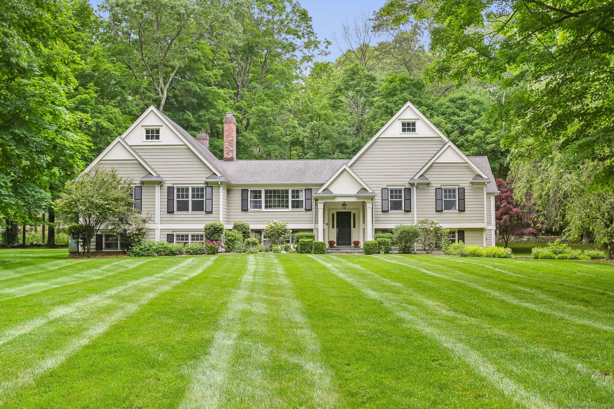 Stunning, impressive home - with LEVEL front yard, towering trees and private driveway
