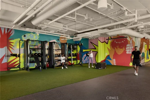 a living room with furniture and large windows