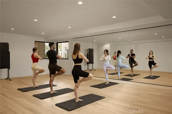 a dining room with furniture and chandelier