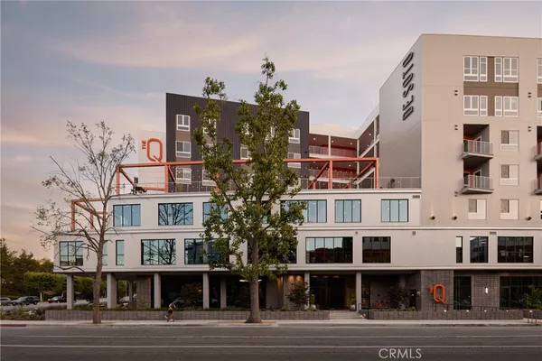 a view of a big building next to a road
