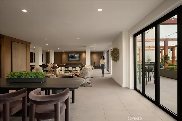 a room with lots of tables a large mirror and furniture