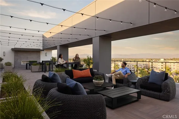 a kitchen with a sink a stove and a refrigerator