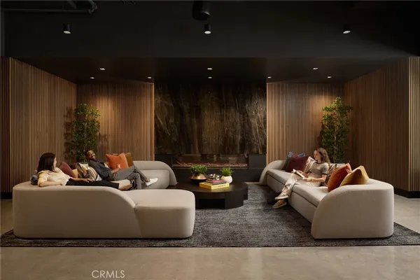 a kitchen with a table chairs stove and refrigerator