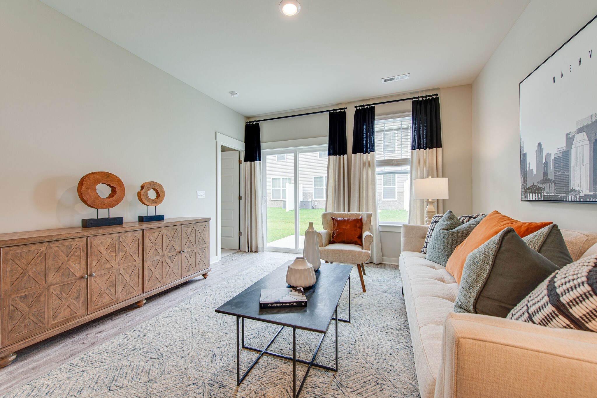 336 Casper Drive Spring Hill, TN 37174 - Photo 5 of 12 a living room with furniture and a wooden floor