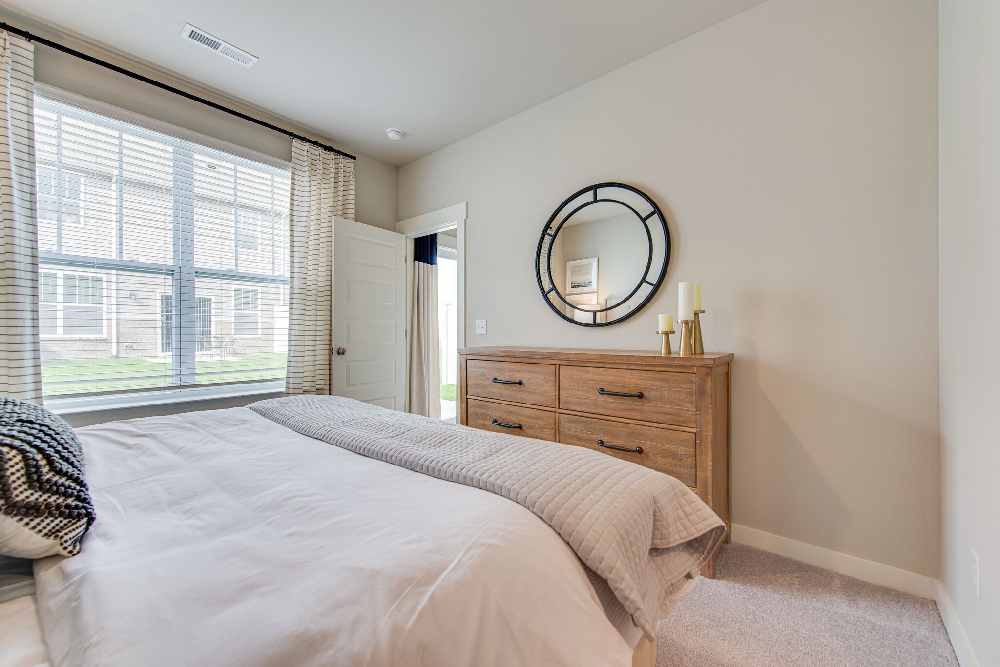 336 Casper Drive Spring Hill, TN 37174 - Photo 8 of 12 a bedroom with a bed and a window