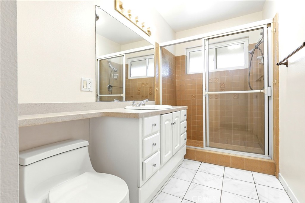 2145 Fairview Avenue Riverside, CA 92506 - Photo 26 of 35 a bathroom with a sink a toilet and shower
