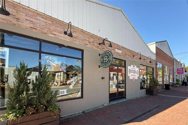 a view of a cafe with sitting area