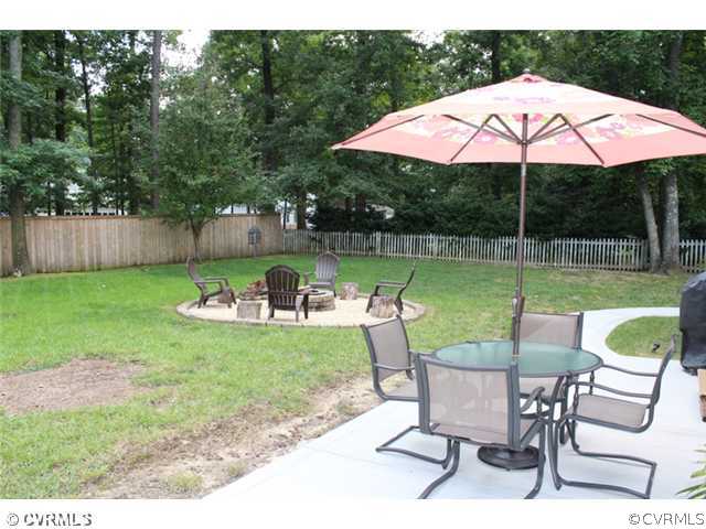 603 Rothschild Drive Chester, VA 23836 - Photo 21 of 24 Yard/Garden - The lightly treed rear yard offers b